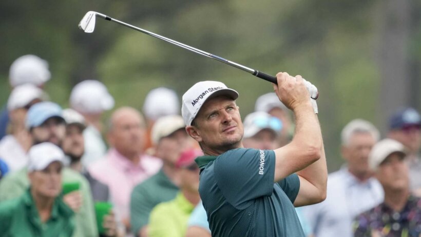 Justin Rose tees off on the 12th tee during a practice round for 2023 The Masters