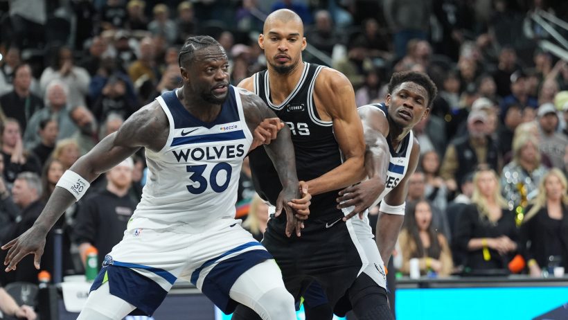 Julius Randle and Victor Wembanyama going for a rebound.